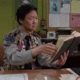 Teacher with book smiling gif