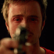 Man with gun coming into focus gif