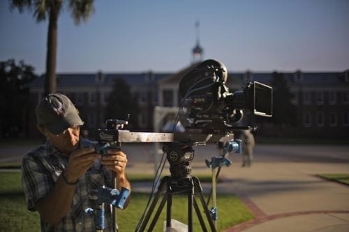 Marc at parris Island w slider Elite Team member Marc Margulies stabilizes the Cine-Slider to be able to handle the Arri III