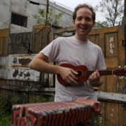 Composer outside with ukulele