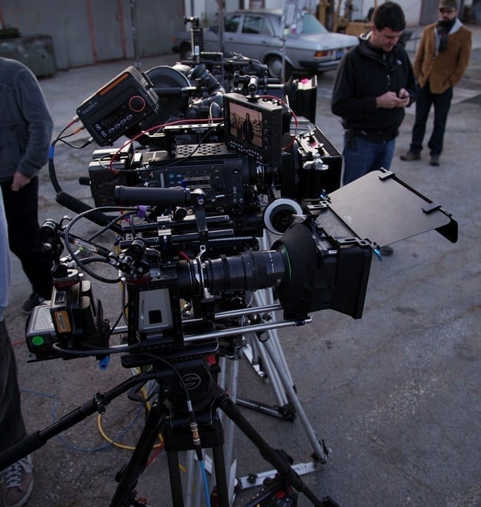 Three large camera rigs outside urban