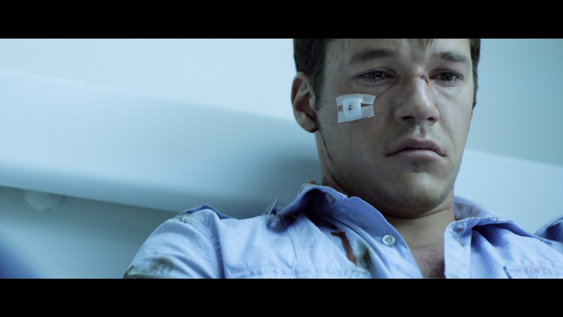 Hospitalized man looking forlorn