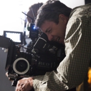 Cinematographer looks through viewfinder