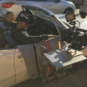 Camera rigged on Hostess Tray Brauer Mount to convertible car