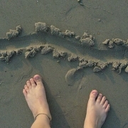 line drawn in sand with bare feet