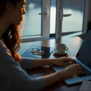 Screenwriter typing on laptop