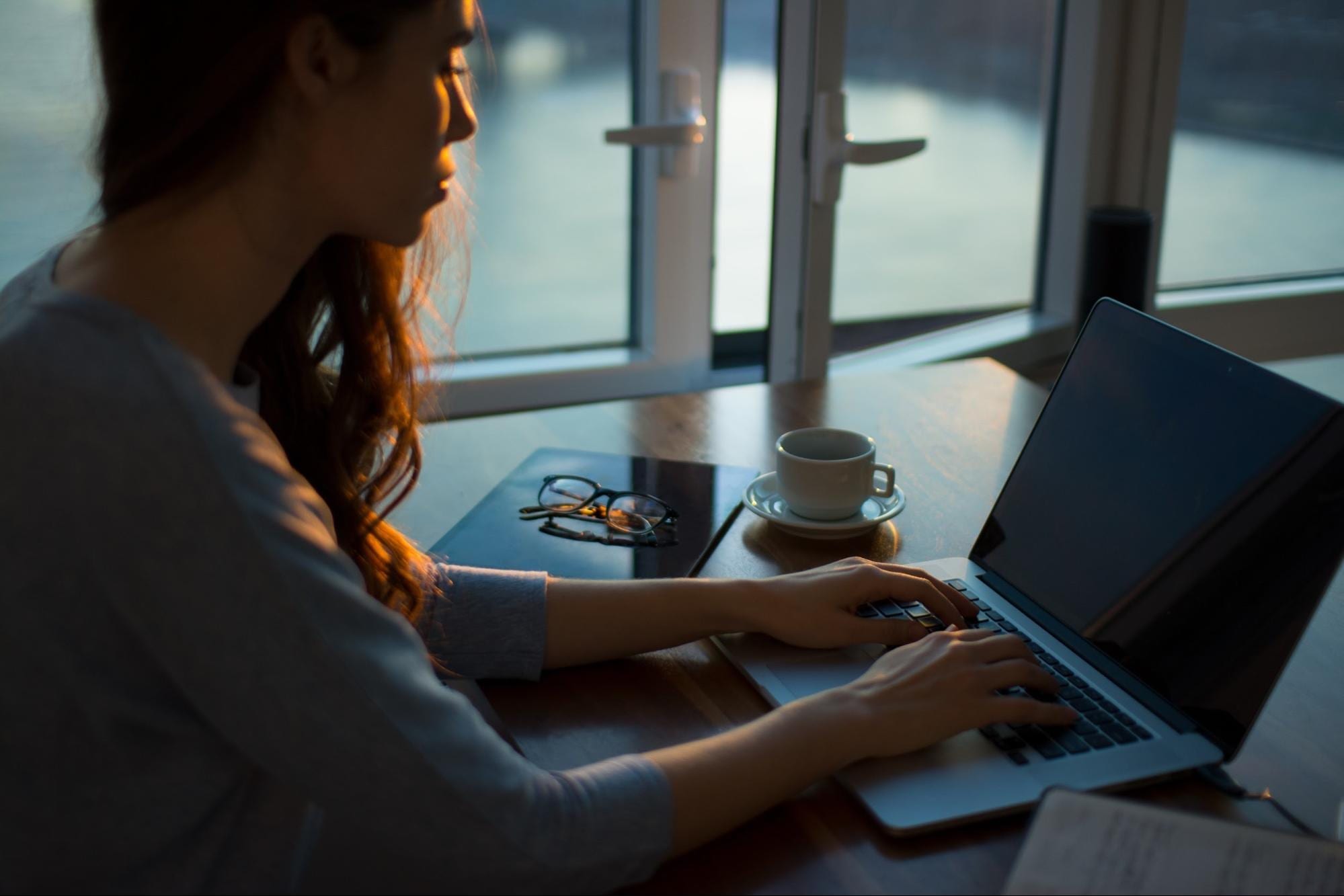 Screenwriter typing on laptop