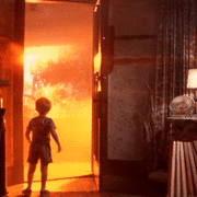 Little boy opens door to an orange glow