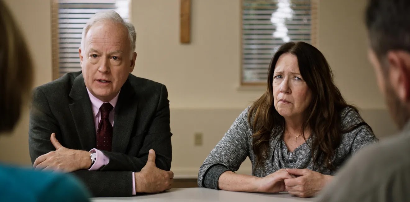 Mass film screengrab of Reed Birney and Ann Dowd