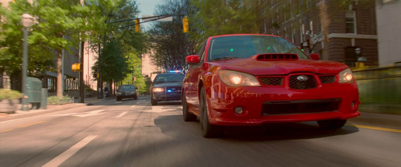 Baby Driver Movie Still - Baby in red car police chase