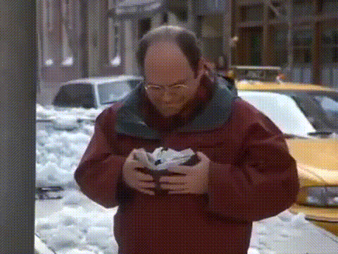 George Costanza trying to close oversized wallet gif