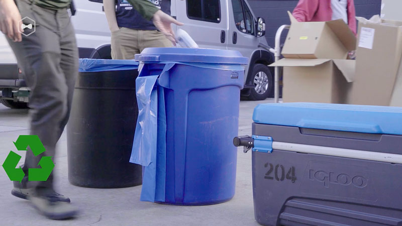 Distinct trash and recycling bins on film set