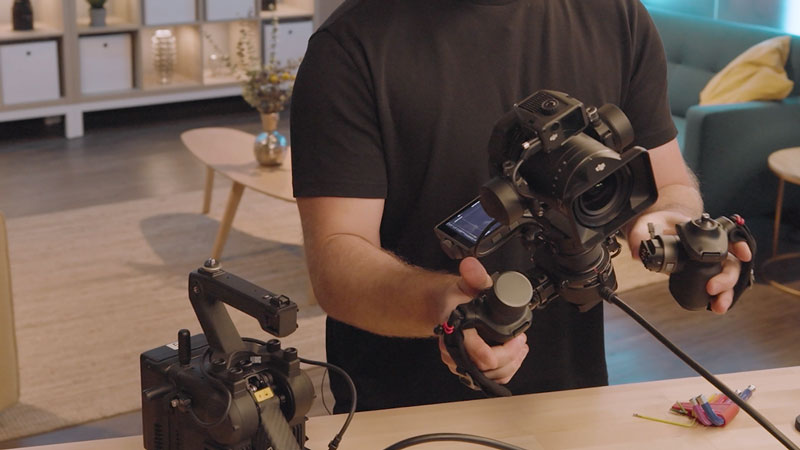 Gimbal operator attaches handgrips to Zenmuse X9