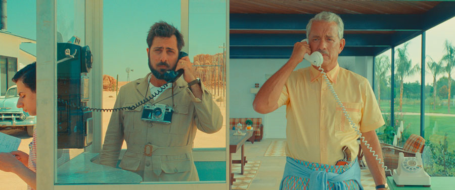 Dual Screens of Augie Steenbeck (Jason Schwartzman) and Stanely Zak (Tom Hanks)
