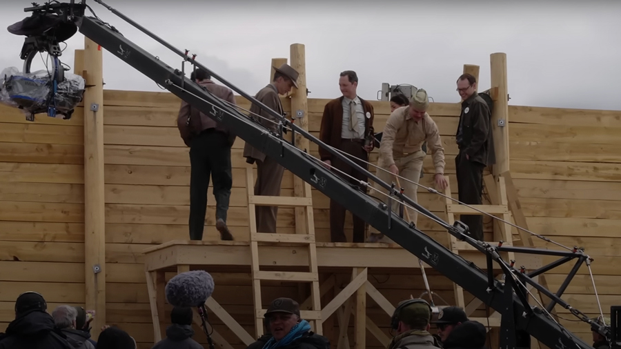 Camera on crane behind bunker wall on Oppenheimer movie