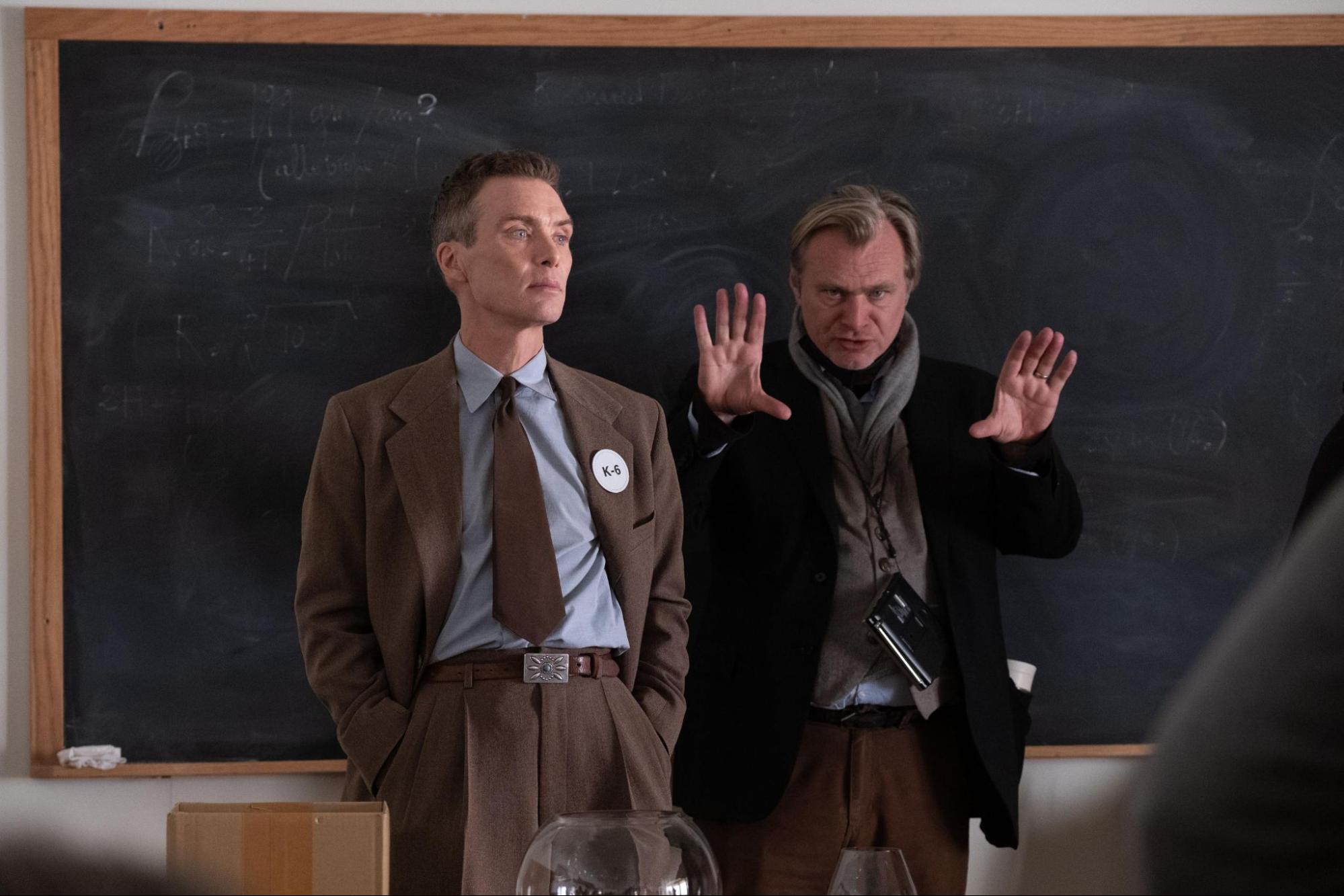 J. Robert Oppenheimer (Cillian Murphy) and director Christopher Nolan, Universal Pictures