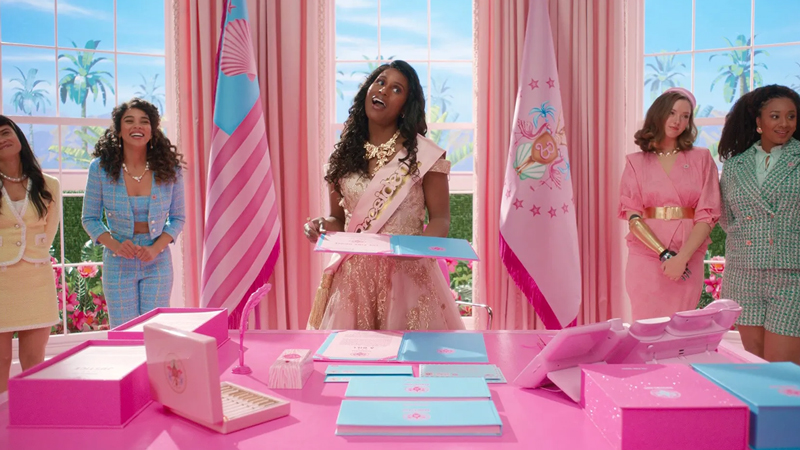 Issa Rae as President Barbie with her Barbie cabinet
