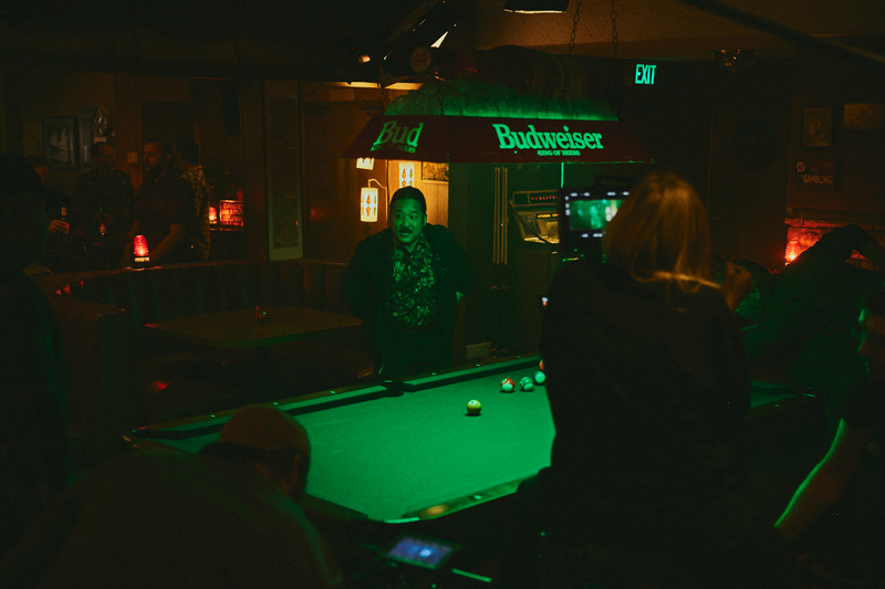 In a bar room with a pool table, Bobby Lee behind the scenes of Drugstore June movie