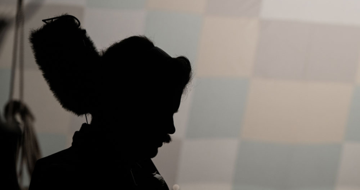 Silhouette of sound technician on set