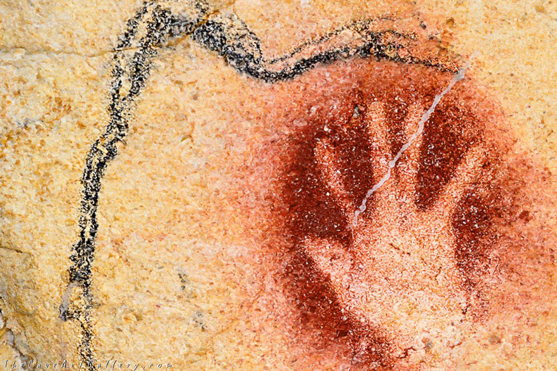 Red hand and mammoth circa 30,000 BP in Chauvet cave, France