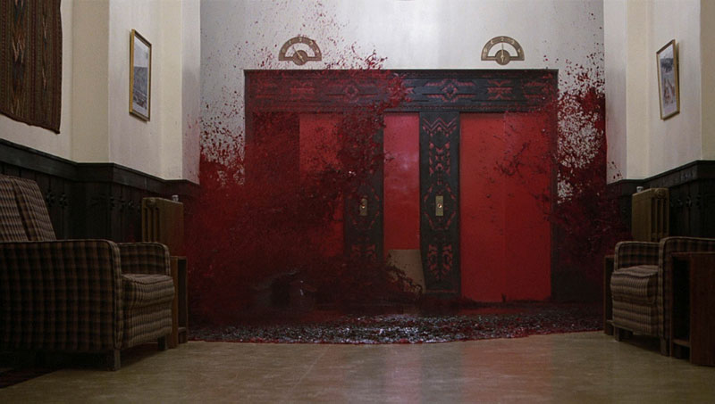 Crimson blood pouring from the elevators in The Shining | Warner Bros.
