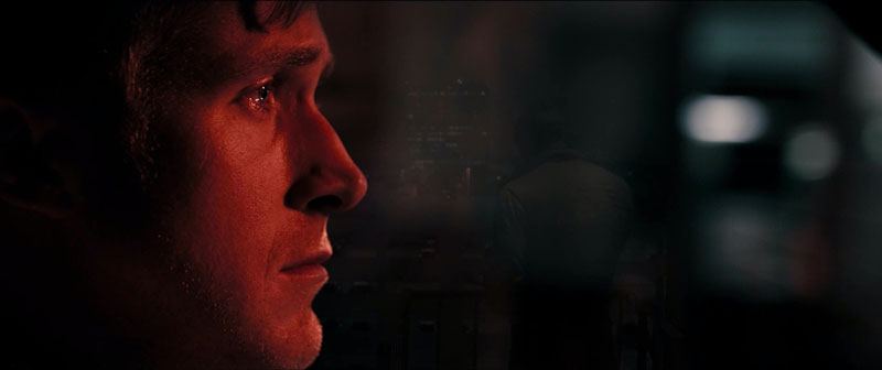 Ryan Gosling bathed in red light in Drive | FilmDistrict