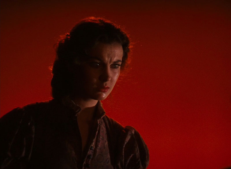 Scarlett O’Hara before a red background in Gone With The Wind | MGM