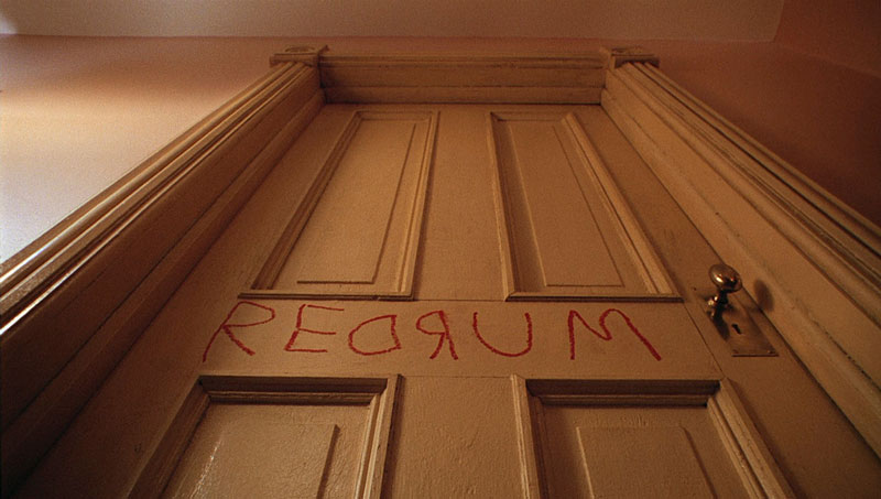 Redrum scrawled on the door in The Shining | Warner Bros.