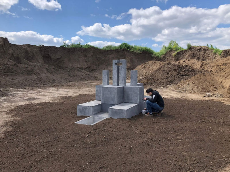 Miniature of brutalist architecture behind the scene of The Brutalist film