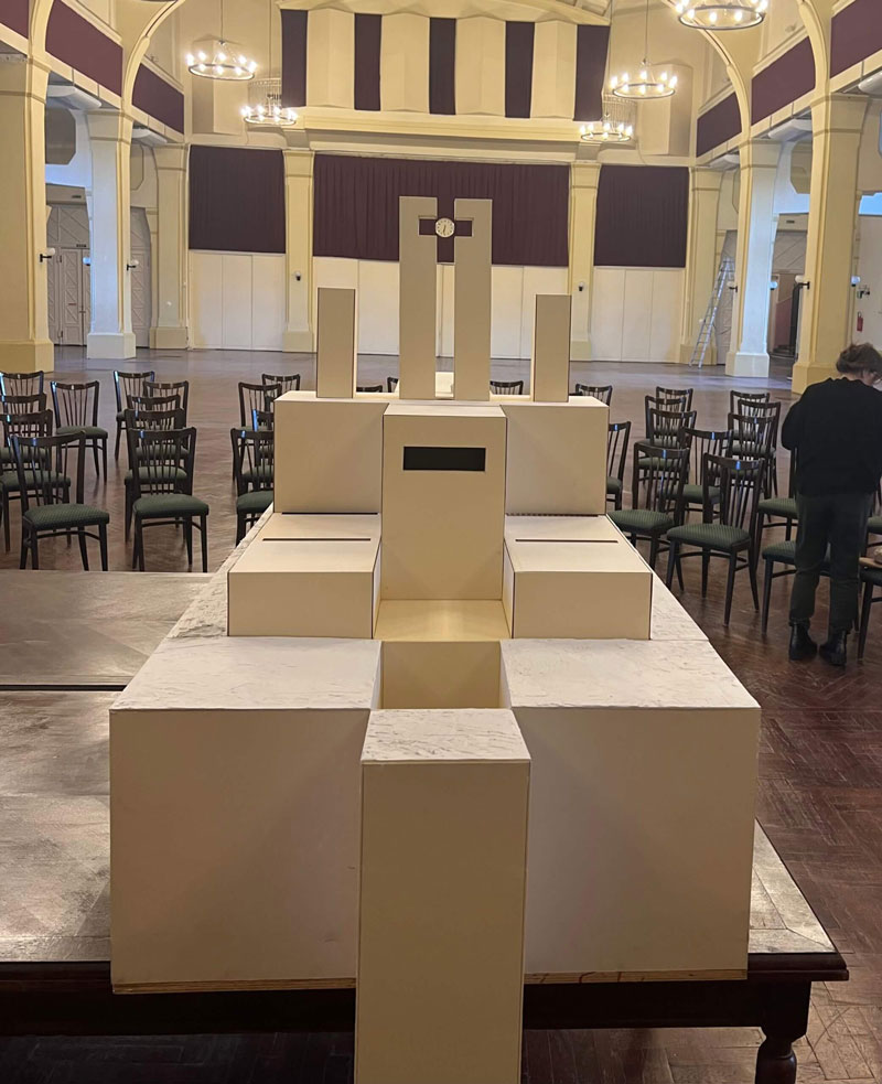 Miniature of brutalist architecture behind the scene of The Brutalist film