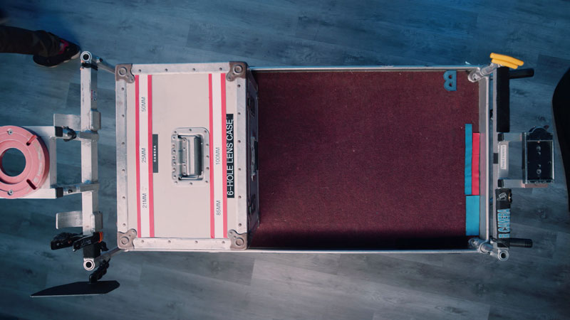 Assistant Camera loads lens cart with lens case