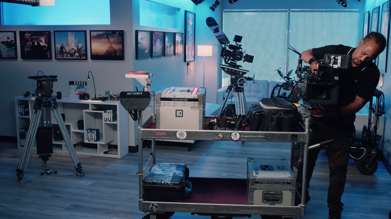 Assistant Camera loads lens cart with camera