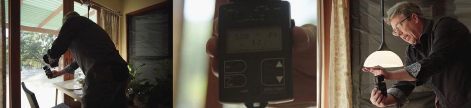 Shane Hurlbut gauges light with light meter for day interior scene 