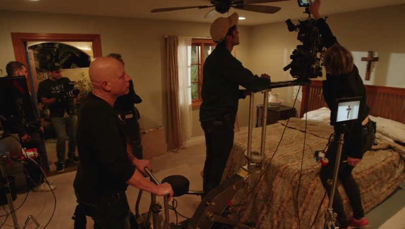 Filmmakers lighting night interior for moonlight