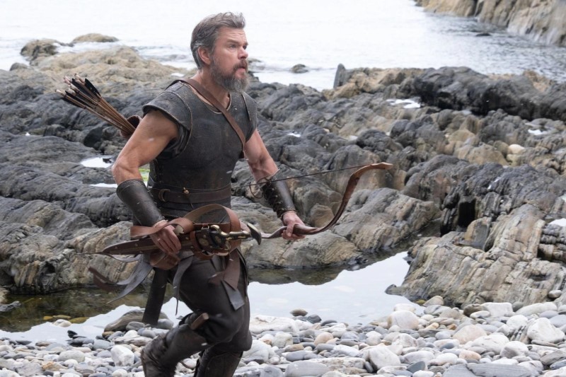Matt Damon as Odysseus with bow