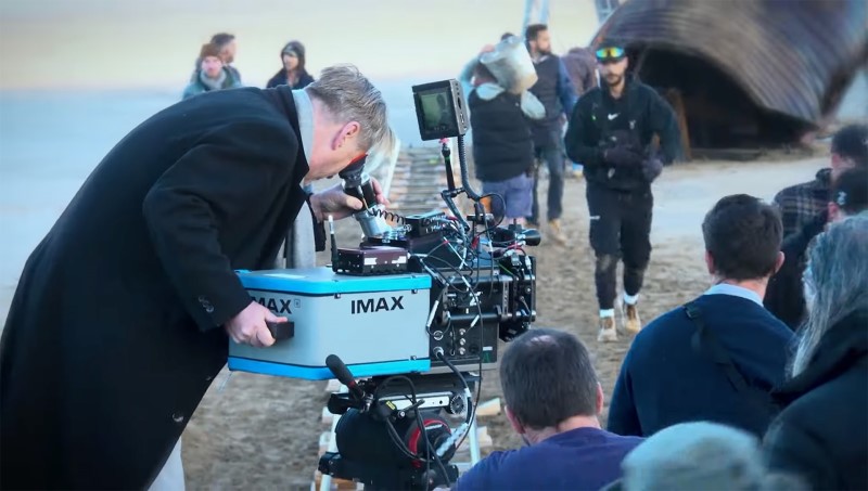 The Odyssey - Nolan with IMAX camera on beach